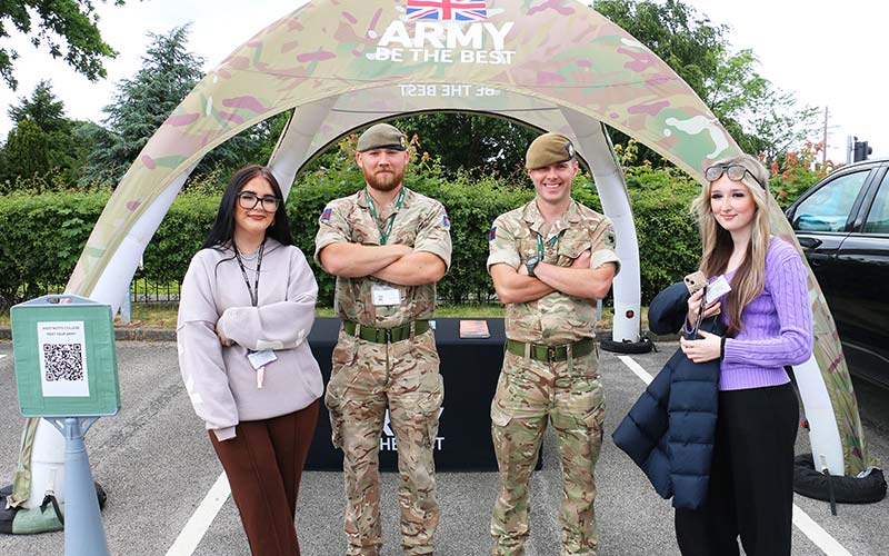 A-Level students Bethany Taylor (first left) and Phoebe Brennan (first right) with Lance Corporal Adam Jenkins (second left) and Guardsman Tobias Boivin at the Military Village.